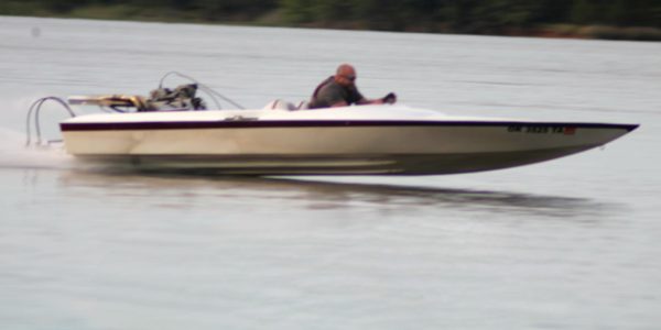 MicroSquirt equipped big block Ford powered jet boat on the water.